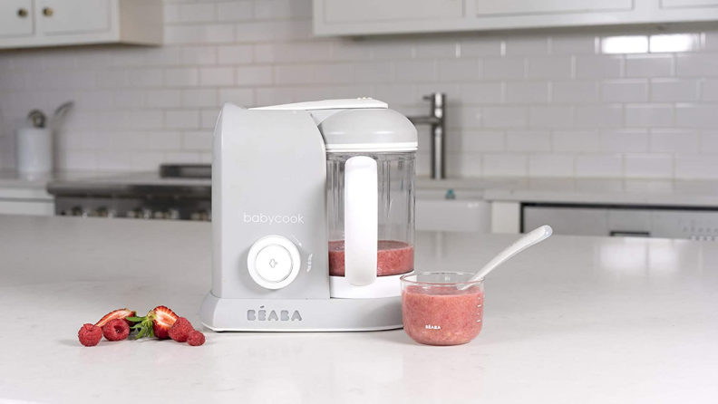 A Beaba baby food maker sitting on a counter