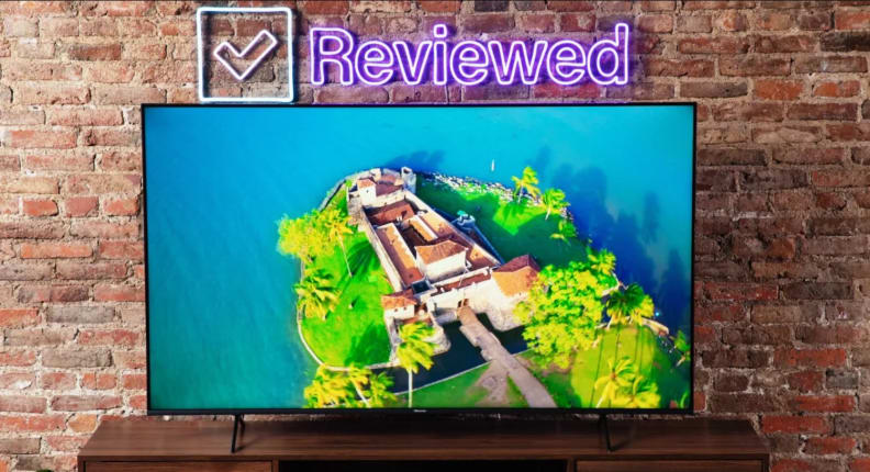 A Hisense U6H in a living room with a display showing an aerial view of an island.