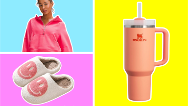 A girl wearing a pink lululemon top, pink smiley face slippers, and a coral Stanley tumbler.