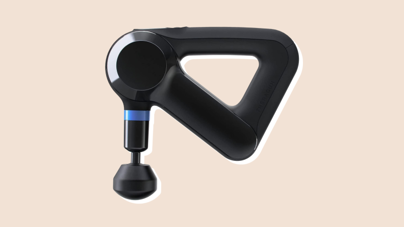 A black TheraGun Prime deep tissue massager on a neutral background.