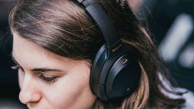 woman wearing pair of Sony headphones