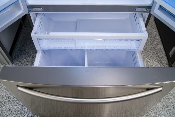 A basic pull-out freezer with two levels of storage. There's a shallow shelf hidden just inside the door of the Samsung RF28HDEDBSR.