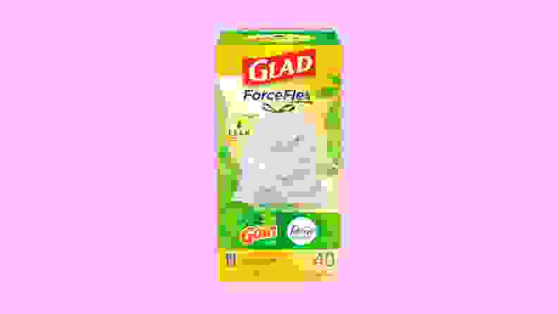 A green and yellow box of Glad ForceFlex Plus trash bags on a purple background.