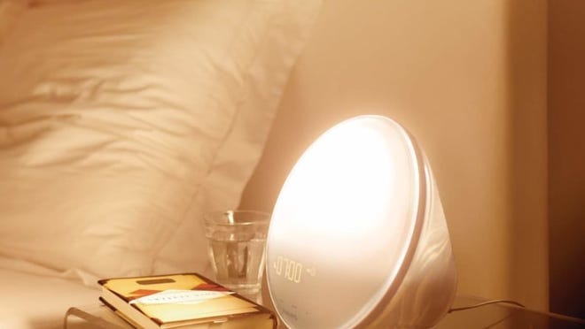 A lamp sits on a nightstand.