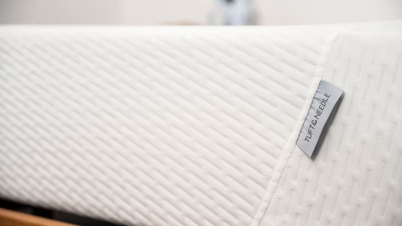a close up of the tag on the foot of the Tuft & Needle Original mattress