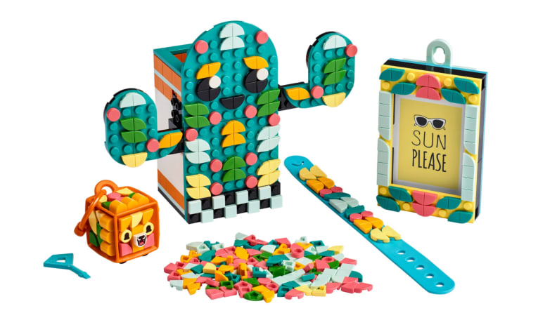 A cactus kit by Lego Dots that shows a pen holder, a slap bracelet, and a key chain