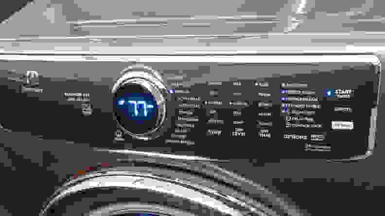 The image shows a dryer’s black interface with white lettering and a round dial in the center that has the number 77 on it.