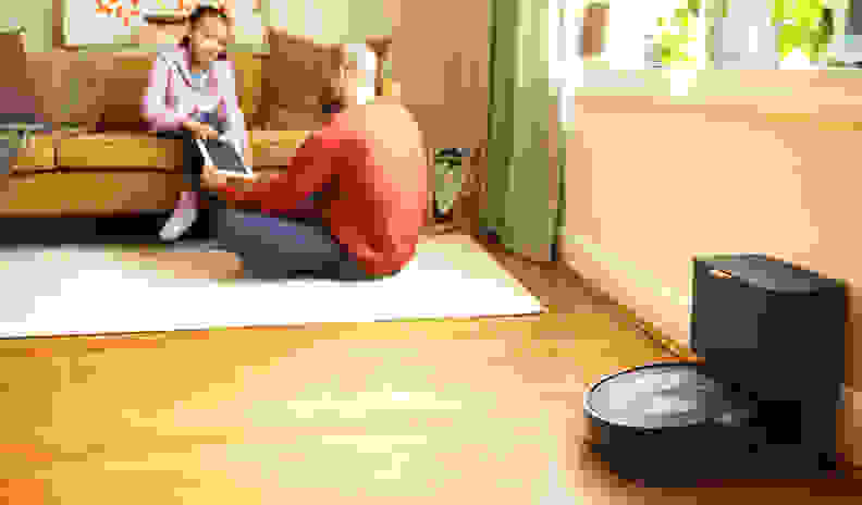 The iRobot Roomba j7+'s dock in a living room