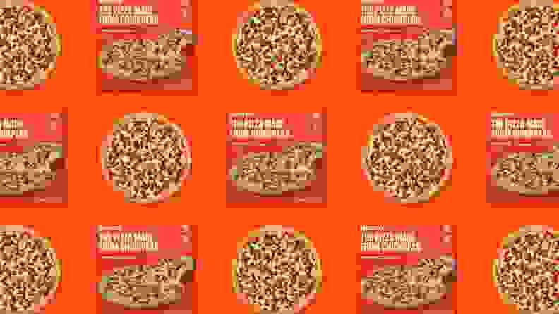 A pattern of frozen pizza boxes and frozen pizzas on an orange background.