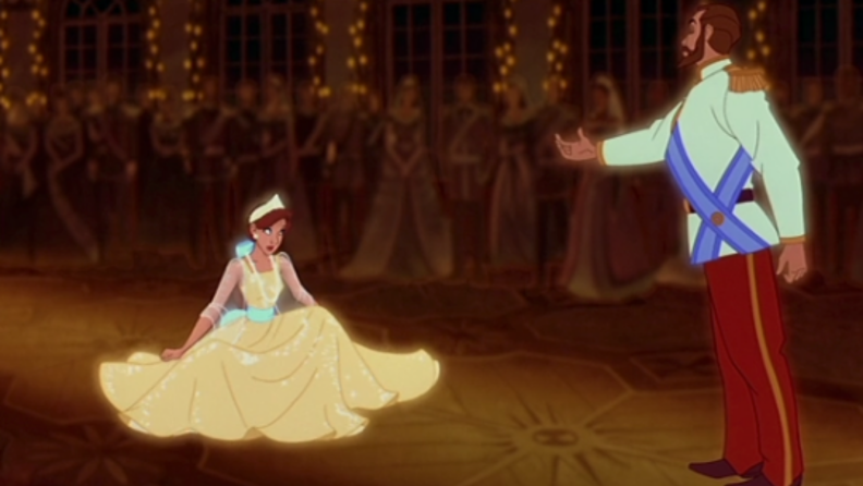 A still from "Anastasia" featuring Anya kneeling before her father in a memory.