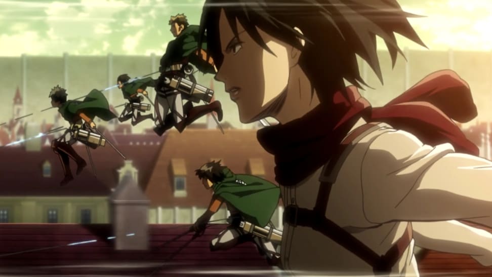 A still from Attack on Titan featuring Mikasa in her gear with the rest of her team.