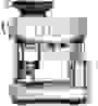 A person places espresso in an espresso machine
