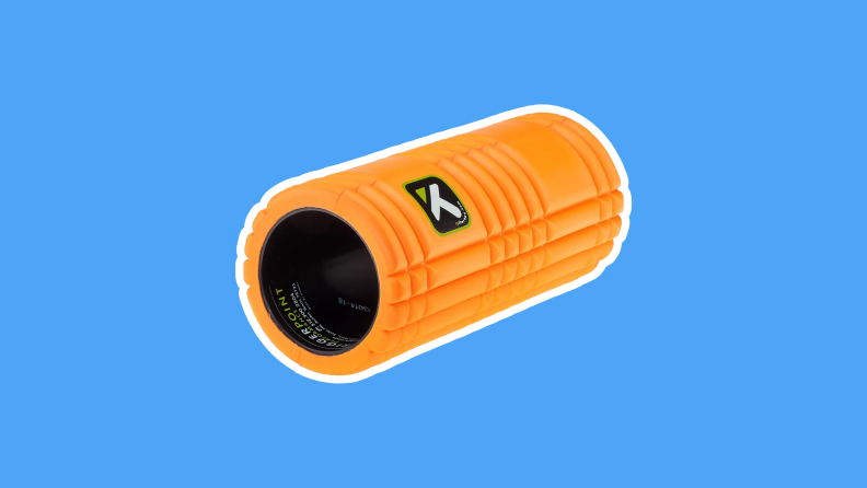 An orange Trigger Point GRID Foam Roller on a blue background.
