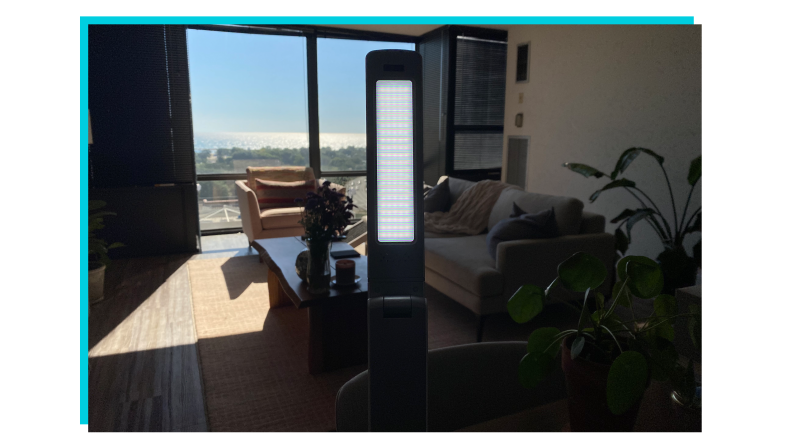 Circadian Optics Light Therapy Lamp on top of table indoors.