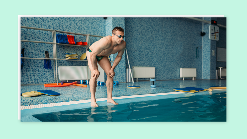 Person peering into pool with goggles.