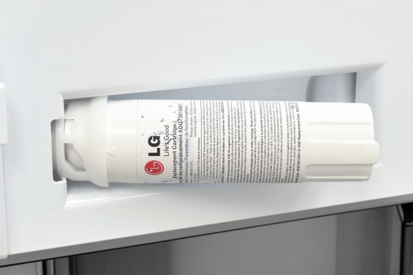 The LG LPXS30866D's water filter is "hidden" in a recessed nook behind the left fridge door's lowest shelf.