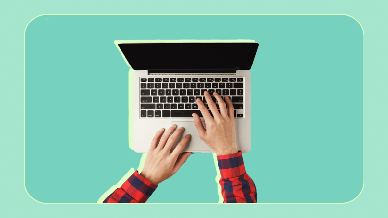 Person using fingers to type of laptop keyboard.