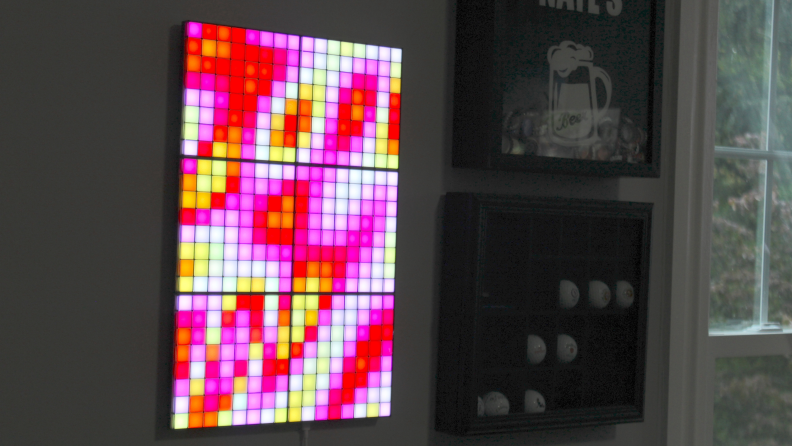 Colorful Twinkly Squares arrangement mounted on wall.