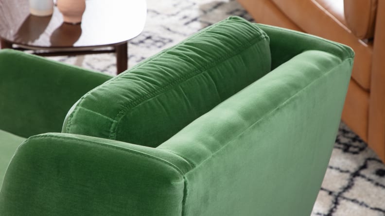 Close-up shot of green velvet material on the Matrix Velvet Chair.