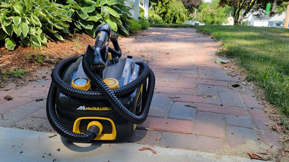 The McCulloch steam cleaner sitting on a brick walkway