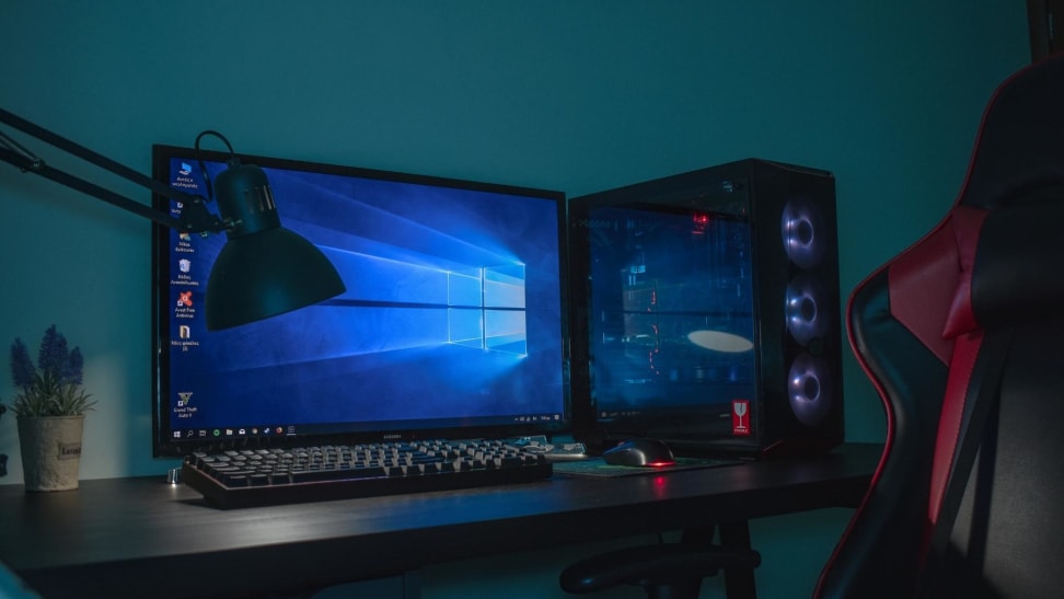 A gaming desktop pc setup complete with a gaming chair.