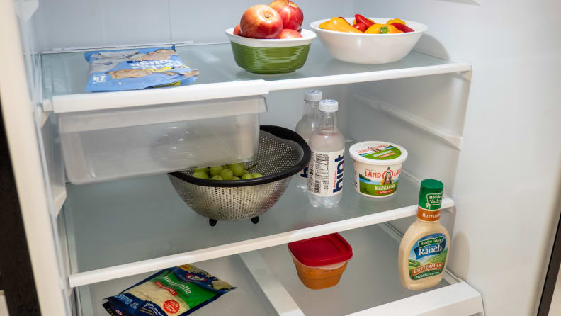 A shot of the interior of the GE GTS22KGNRBB top-freezer's refrigerator compartment. If you've seen a fridge interior, you've seen this one.