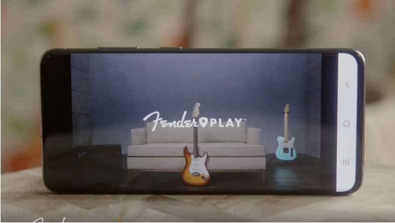 A photo of a phone playing a Fender online class.