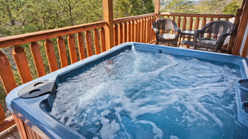 Close up of a hot tub on a deck.