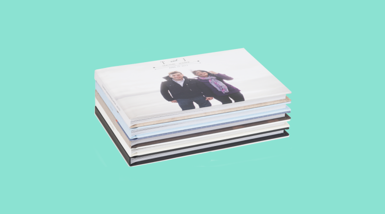 stack of photo books on green background