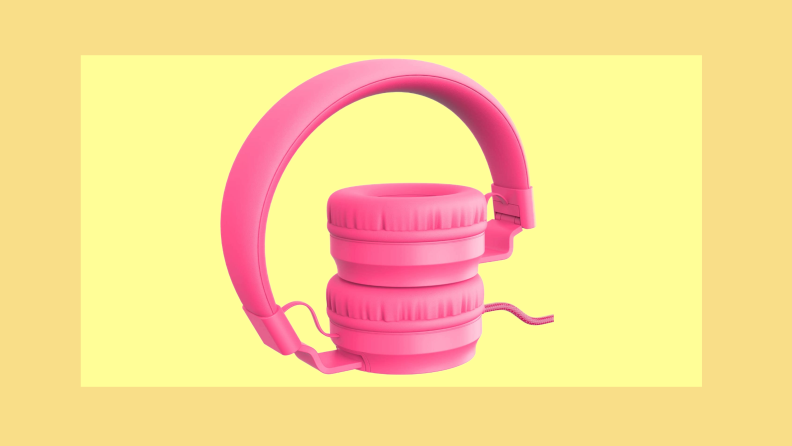 A pair of pink headphones on a yellow background.