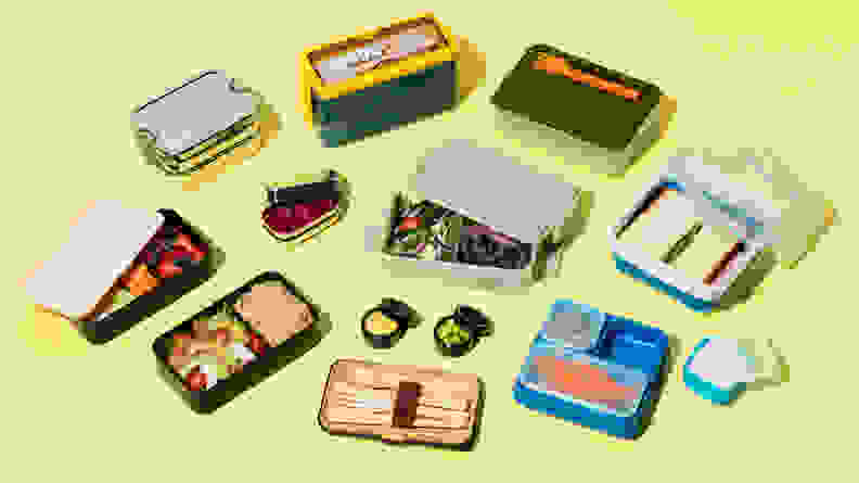 An assortment of snacks and a lunchtime meal sorted in multicolored Bento Boxes.