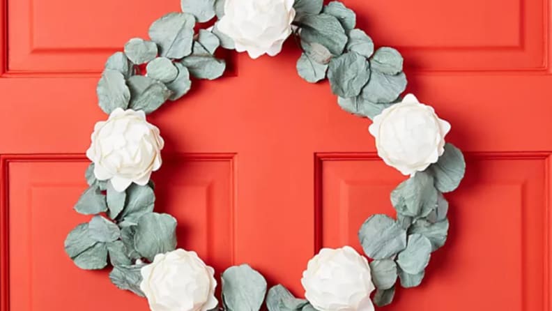 Paper eucalyptus wreath hanging on a read door