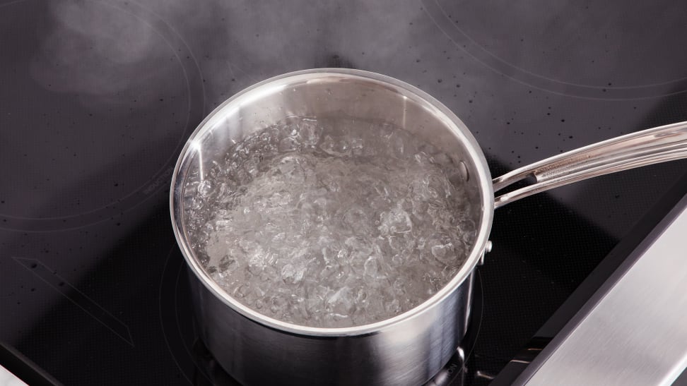 A pot of boiling water on a GE Café induction cooktop