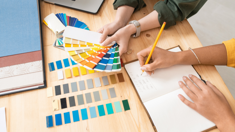 A client and a designer pick a color palette for a design.