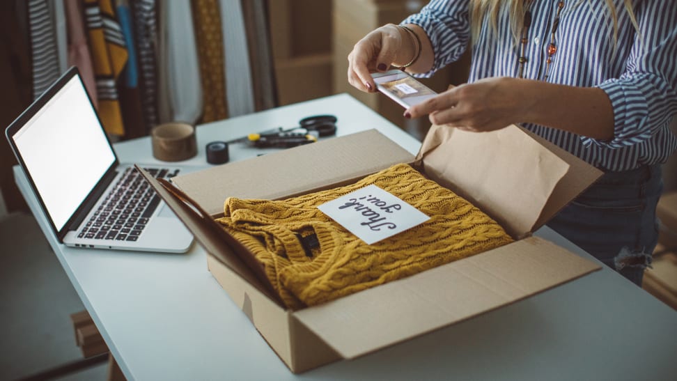 Woman shipping a sweater she sold online