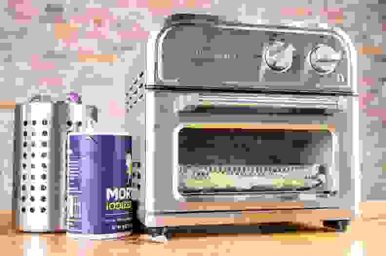 Closeup of an air fryer on a countertop.