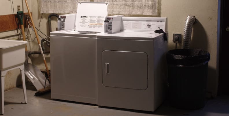 A washer and dryer in a basement