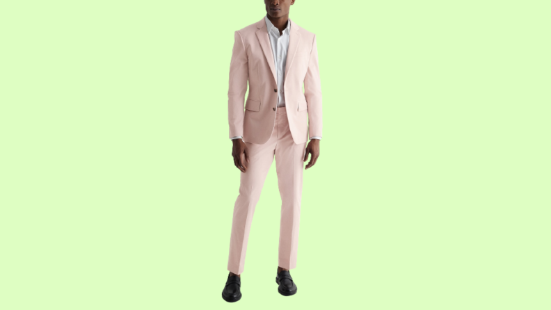 A model wearing a pink suit.