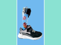 The Stride Rite kids shoe with a brace on a blue and green background.