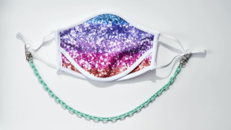 Colorful sequin face mask with turquoise plastic chain.