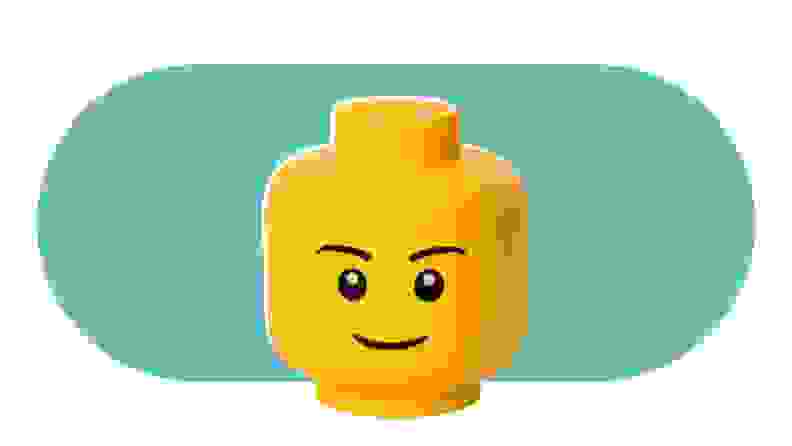 A large, yellow, Lego head that is also a storage bin for Lego's.