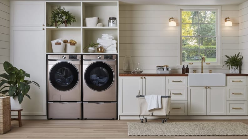 The Samsung washer in dryer side by side in a laundry room.