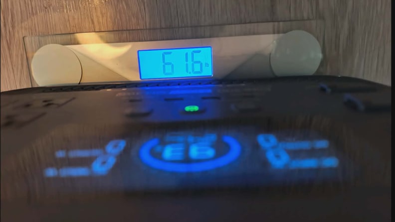 Downward facing closeup showing Bluetti Elite 300 sitting on a scale that reads 61.6 pounds