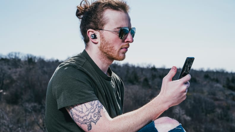 Sennheiser Momentum TW 2 holding phone