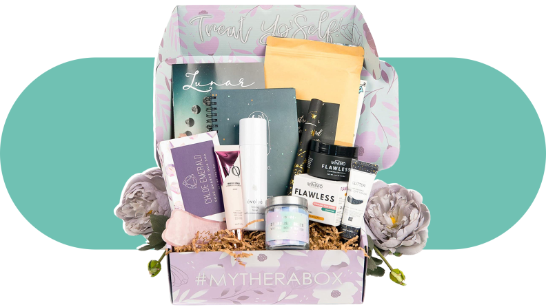 TheraBox Self Care Kit inside of box with numerous products for wellness inside.