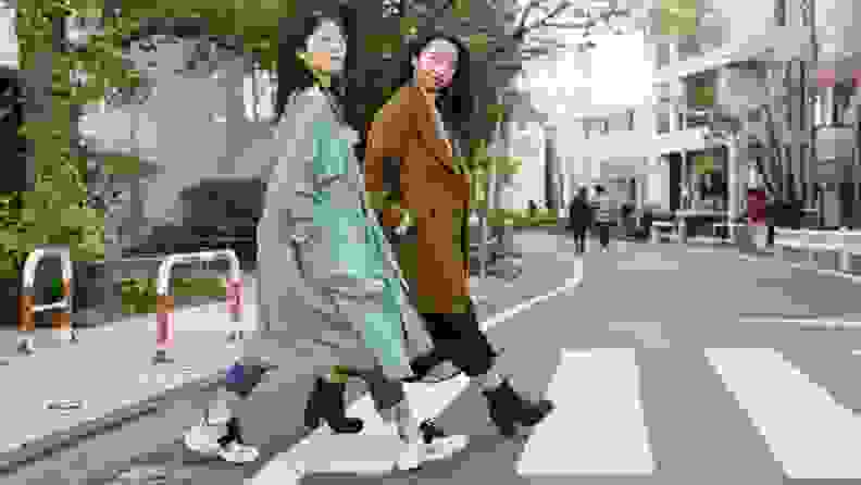 two women crossing the street in Japan