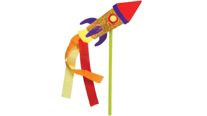 A papercraft of a colorful rocket with streamers.