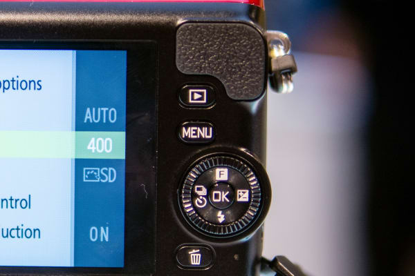 The rear controls on the Nikon 1 S2 cover all the basic exposure and shooting mode shortcuts.