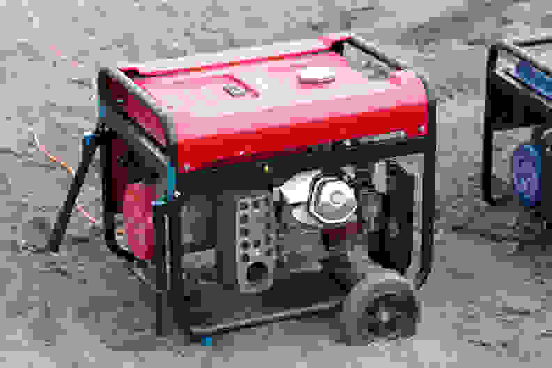 A portable generator set up on a beach.