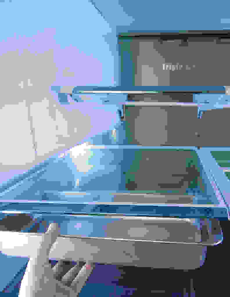 Twin chef pans are kept underneath one of the adjustable shelves.